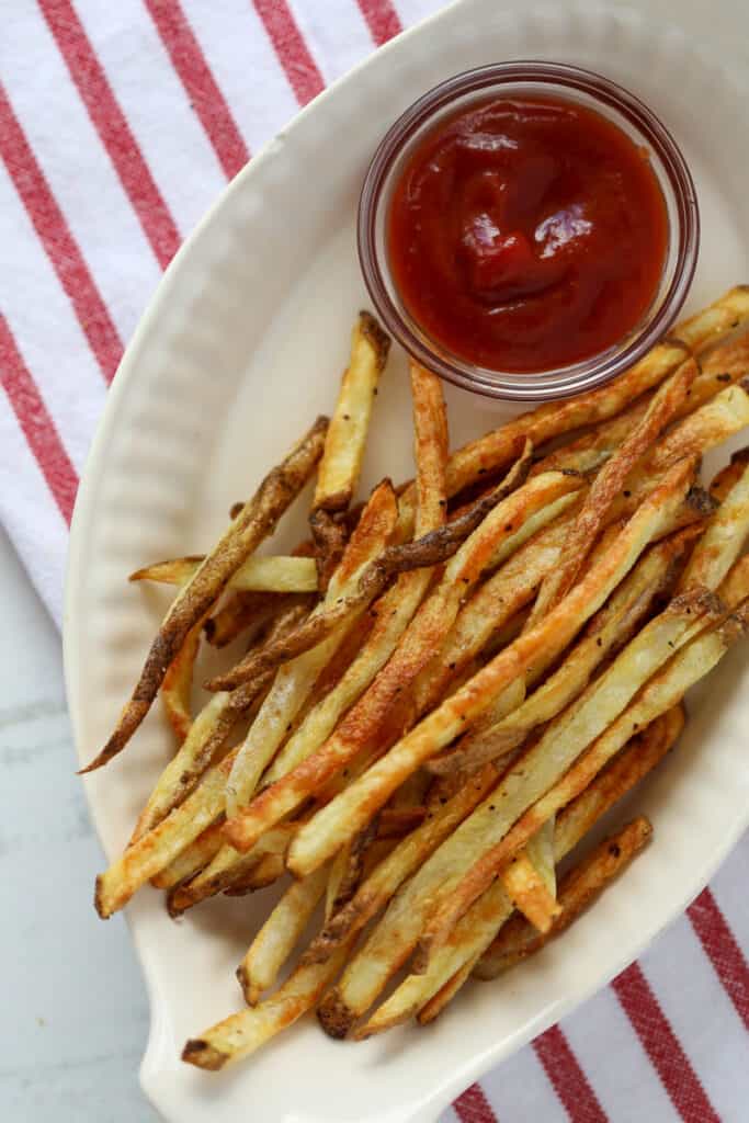 crispy air fryer french fries in a white dish 