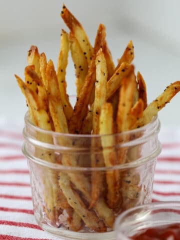 french fries in air fryer in a mason jar standing up