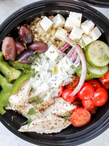 greek salad meal prep bowls combined in meal prep containers for lunches