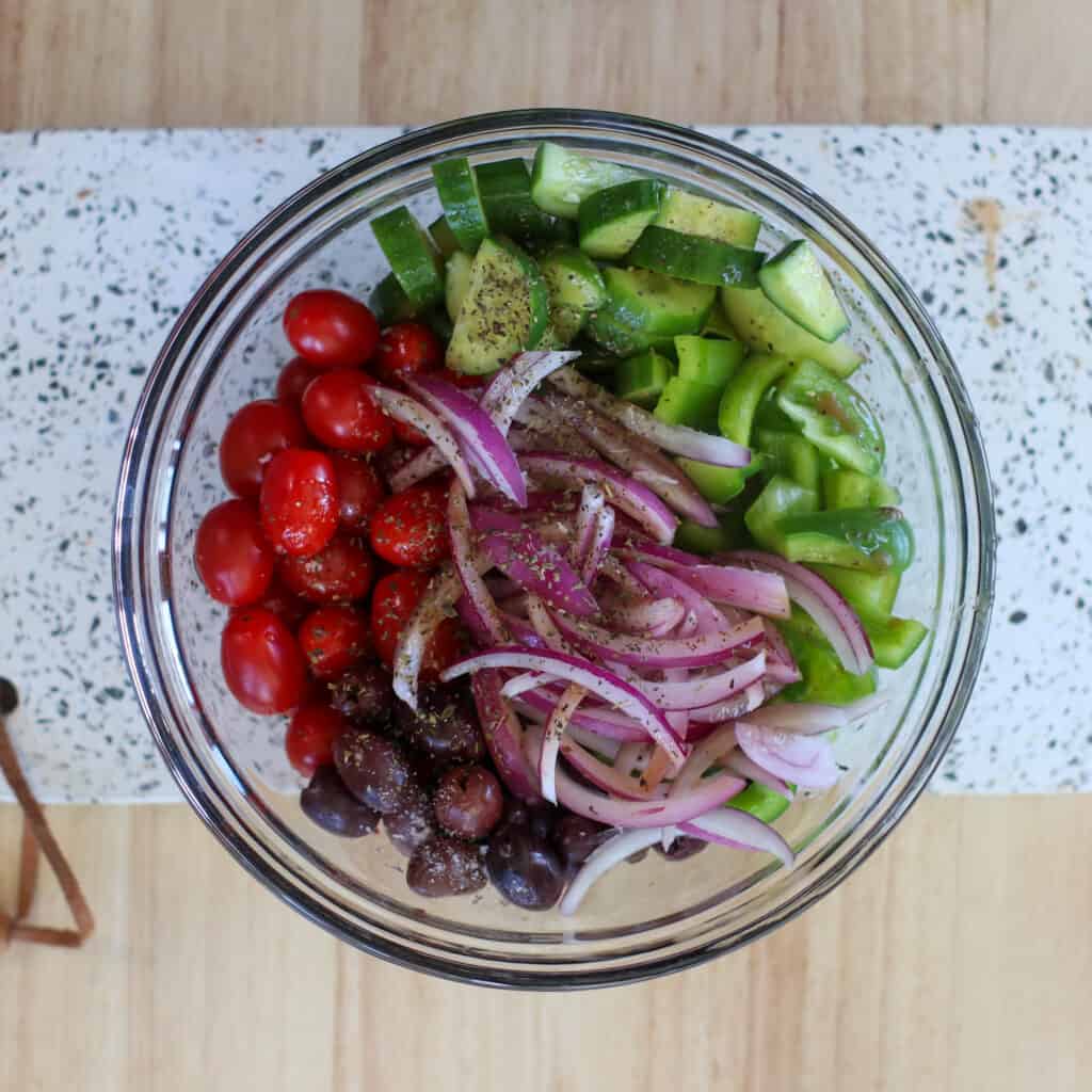 greek tomato and cucumber salad ingredients ready to be combined