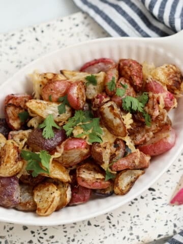 keto air fryer radishes top down view in a white serving dish