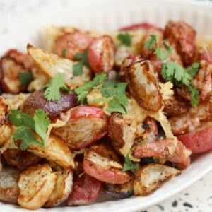 close up of radishes in air fryer with cheese