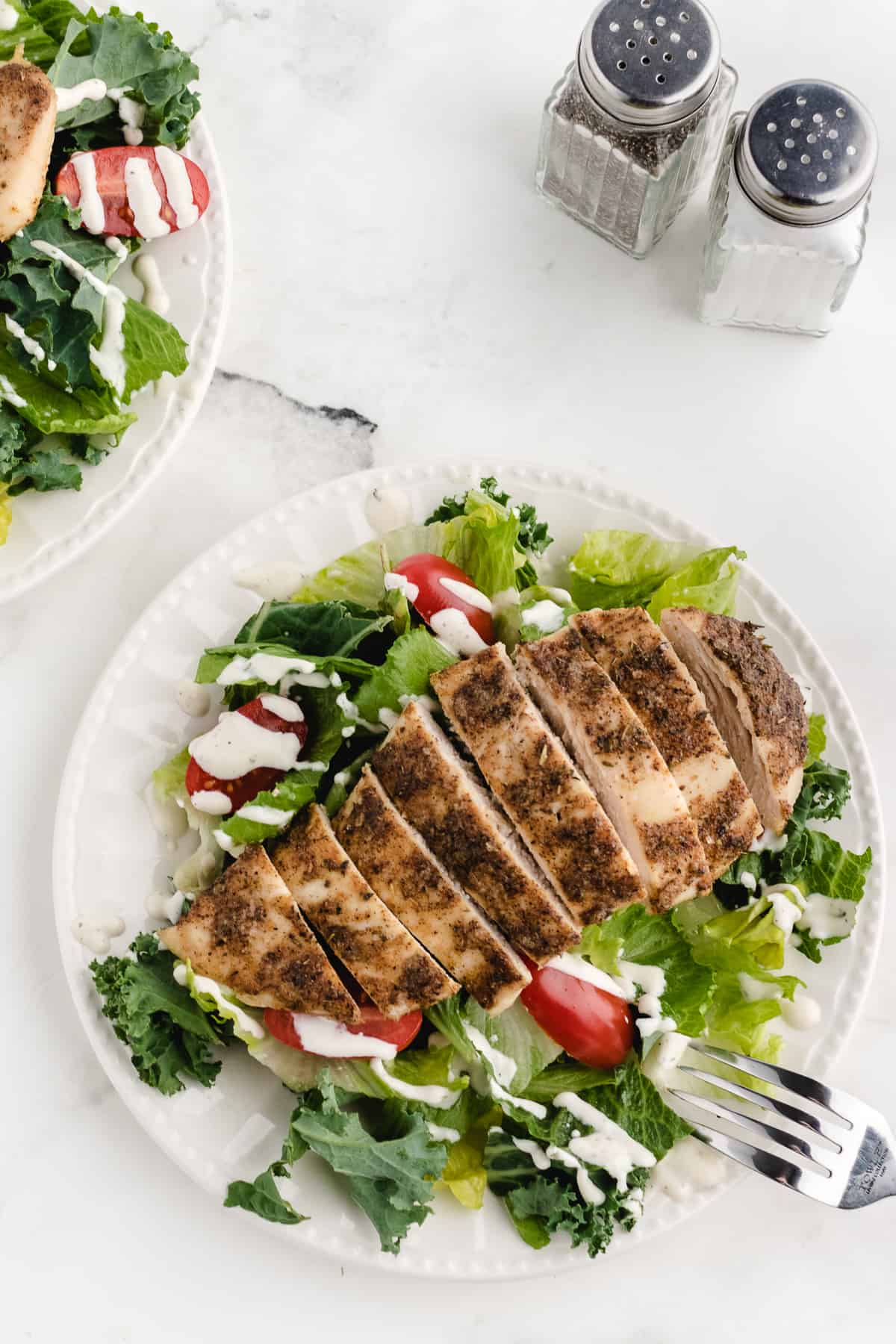 baked thin sliced chicken breast added to a salad