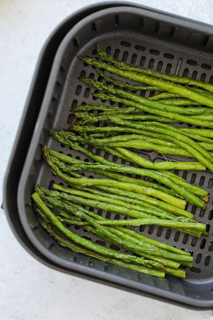 roasted air fryer frozen asparagus in the air fryer basket