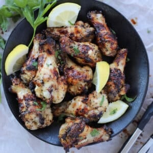air fryer lemon pepper wings with lemon wedges