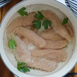 boiled chicken tenders before cooking in a pot on the stovetop
