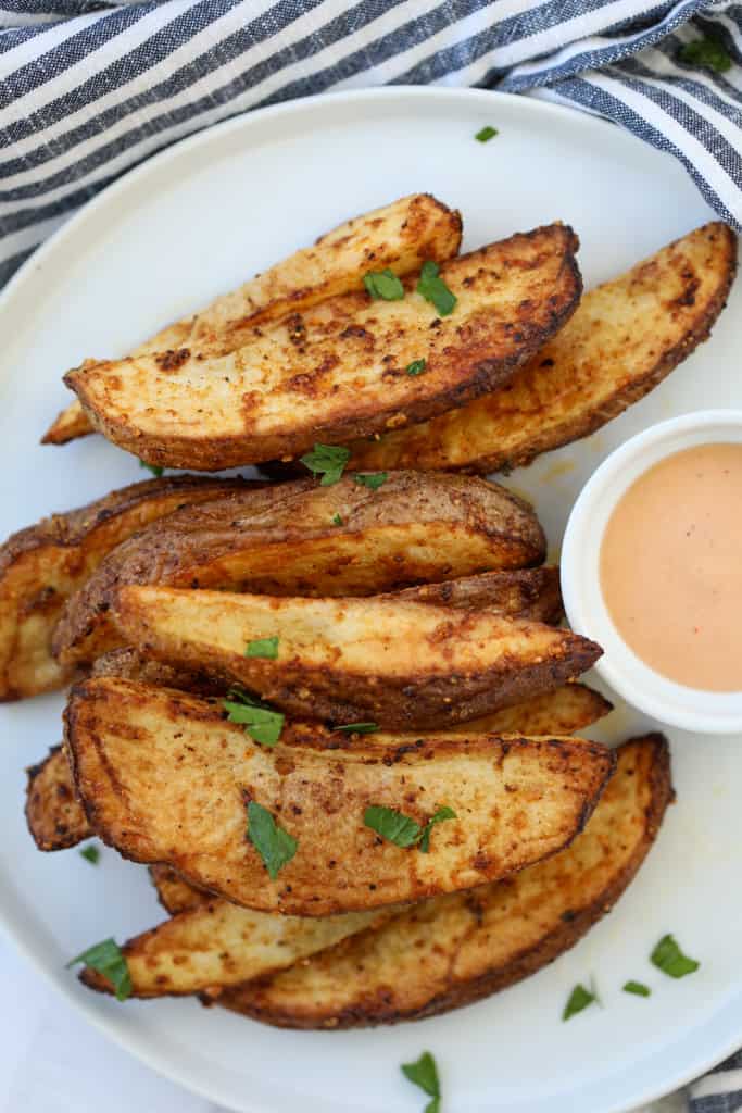 potato wedges air fryer recipe on a white plate with fry sauce