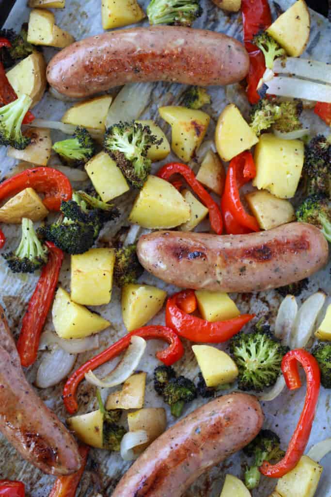 baked chicken sausage with peppers and potatoes on a sheet pan 