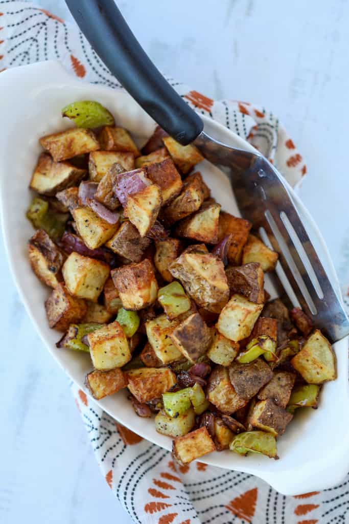 home fries in air fryer recipe in a white serving dish