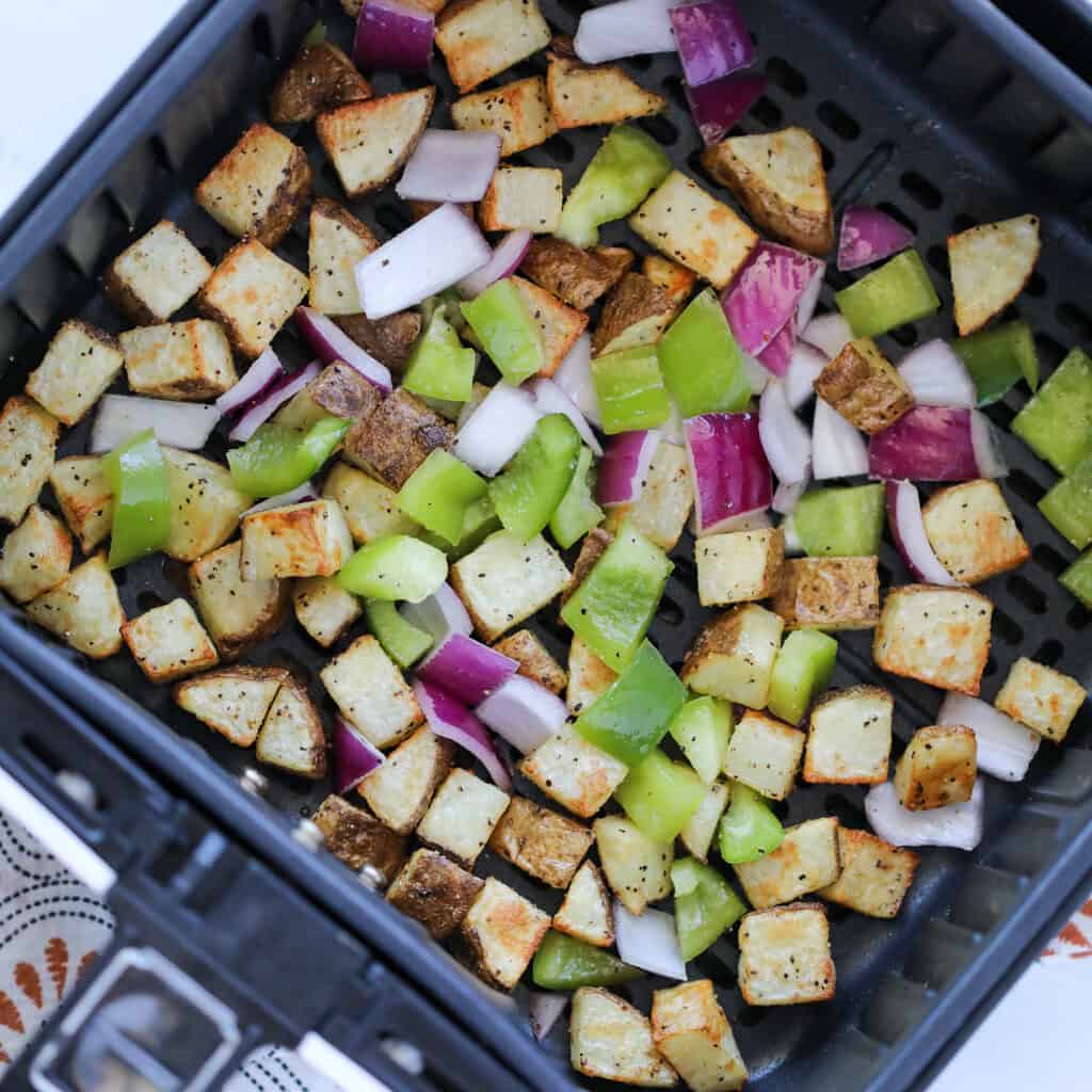 homemade air fryer home fries with bell peppers after cooking
