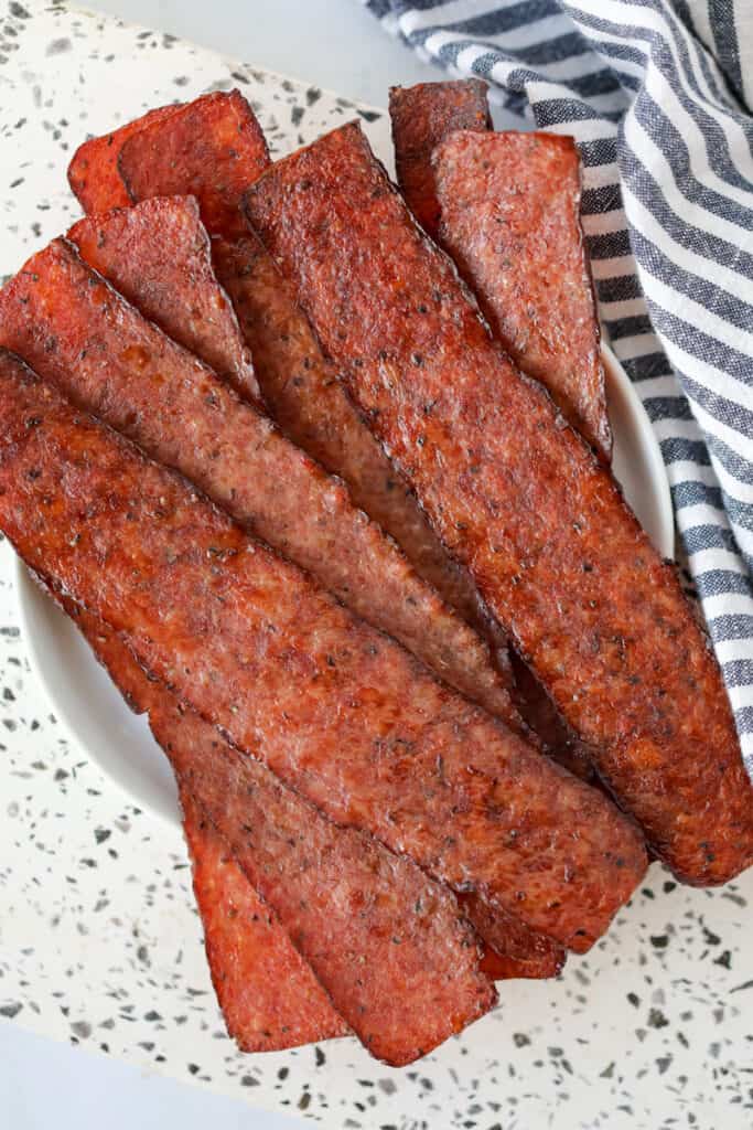 cooking turkey bacon in the oven until crispy served on a plate