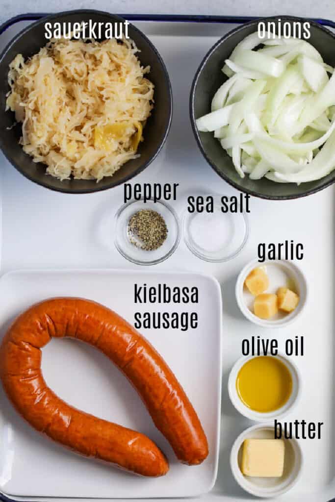 kielbasa and sauerkraut stovetop recipe ingredients on a tray