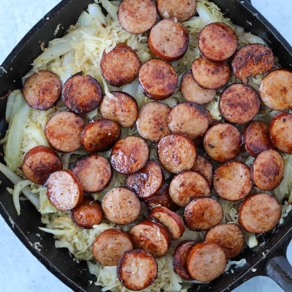 combine the sauerkraut and polish sausage in the pan