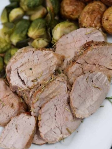 air fryer pork tenderloin slices on a plate