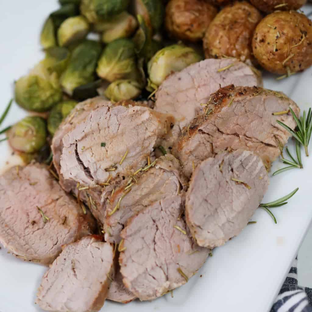 air fryer pork tenderloin slices on a plate
