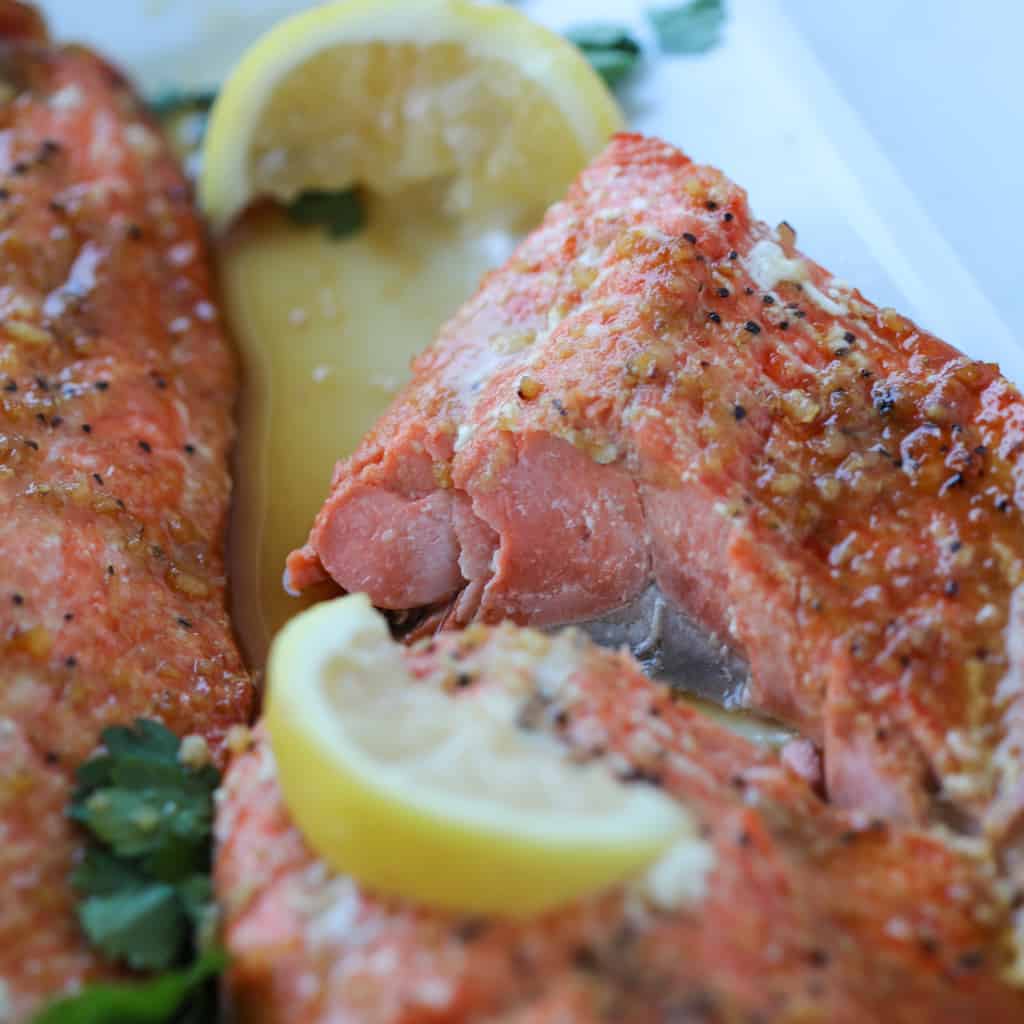 cooking flakey air fryer salmon until it's lightly pink inside