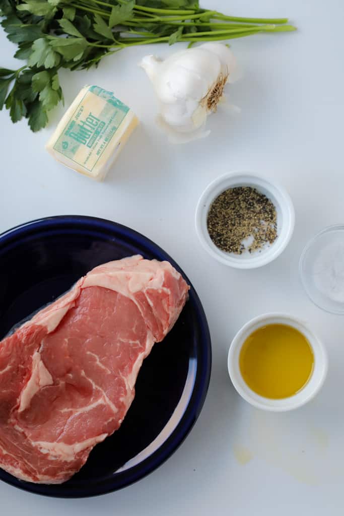 ribeye in air fryer ingredients on a tray