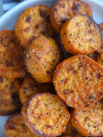 sweet potato slices air fryer on a plate after cooking