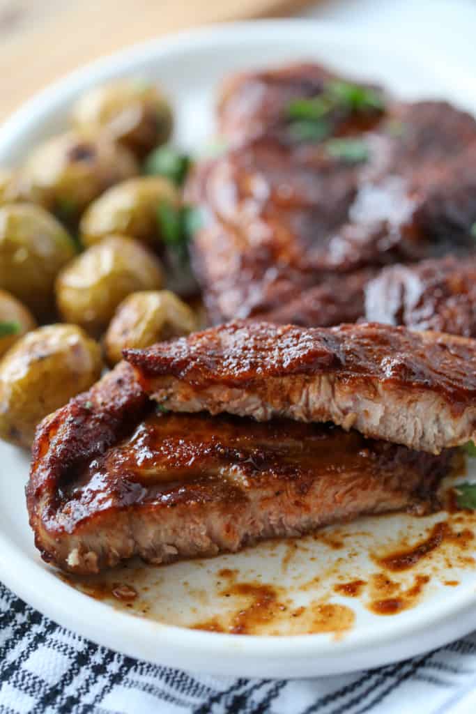 pork steaks sliced on a place with potatoes