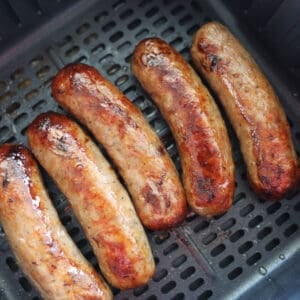 frozen sausage in air fryer close up after cooking