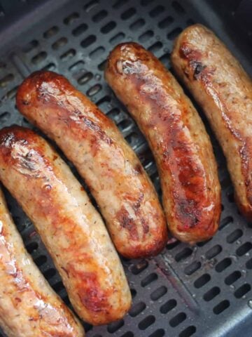 frozen sausage in air fryer close up after cooking