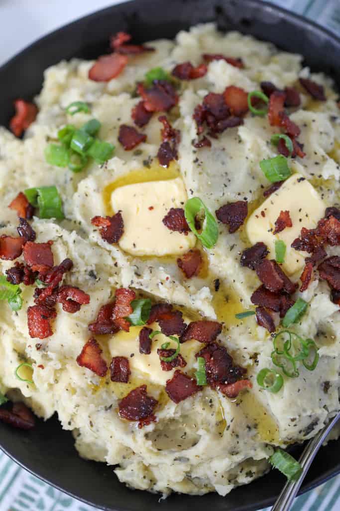 irish instant pot colcannon with bacon close up with melted butter