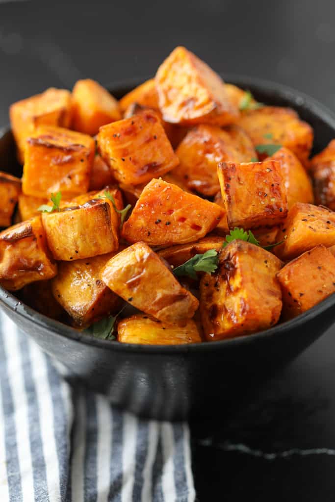 air fryer sweet potato cubes in a dish