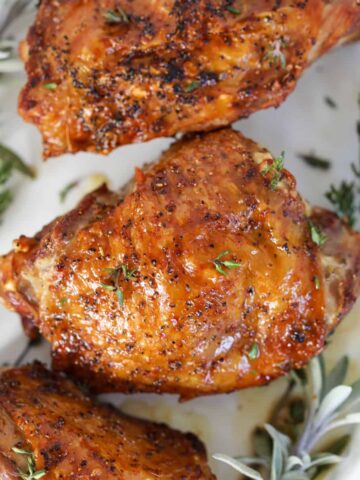 air fryer turkey thighs close up with crispy skin on bone in