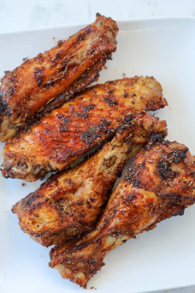 air fryer turkey wings after cooking on a white plate