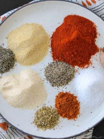 homemade blackening seasoning on a white plate before combining