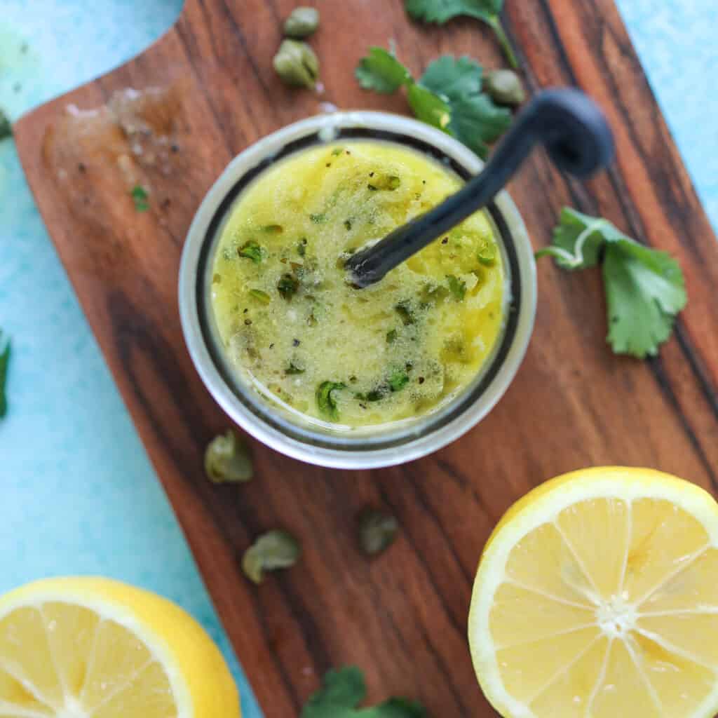 lemon caper sauce on a cutting board