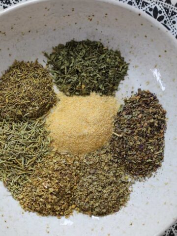 diy italian seasoning recipe individual ingredients on a white plate