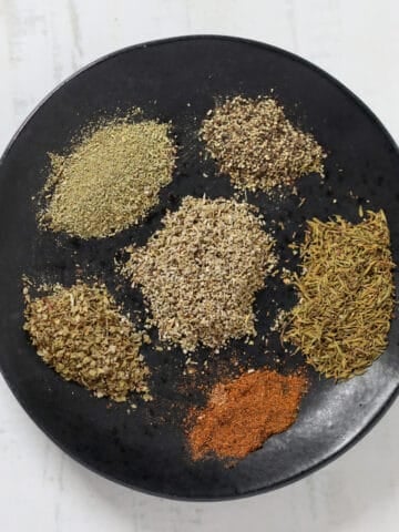 diy substitute for poultry seasoning to make at home on a black plate