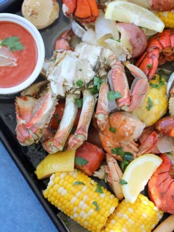 seafood on a baking sheet after cooking seafood boil recipe