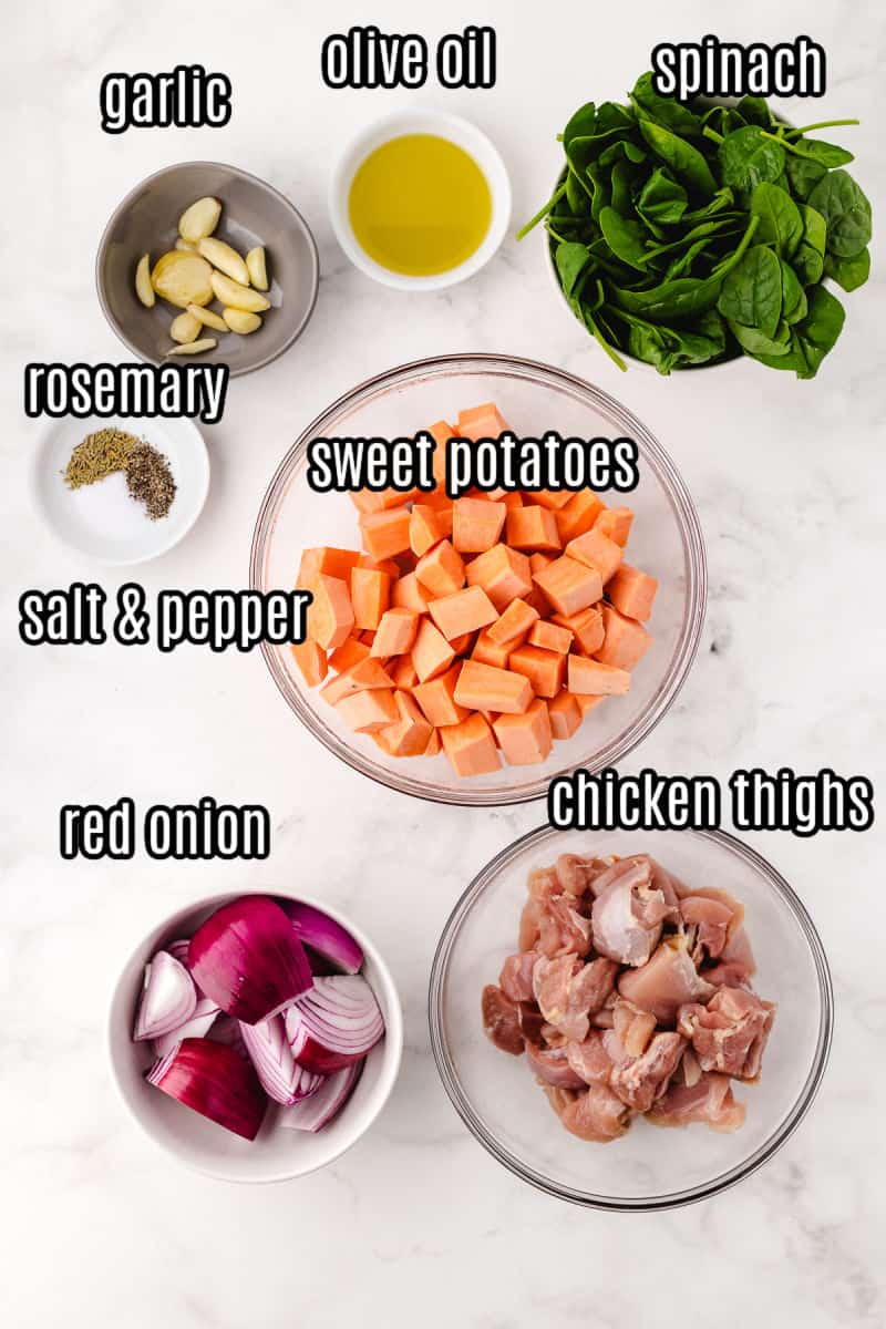 sheet pan boneless chicken thighs recipe ingredients on a white background