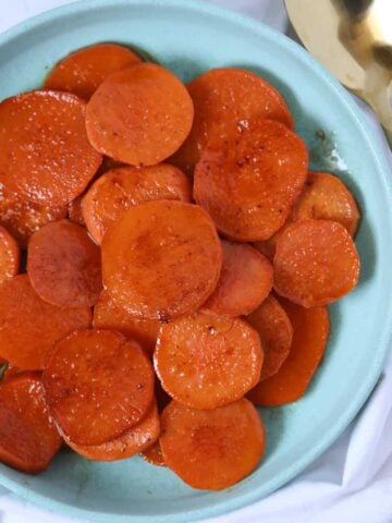 sweet potato slices in oven in dish