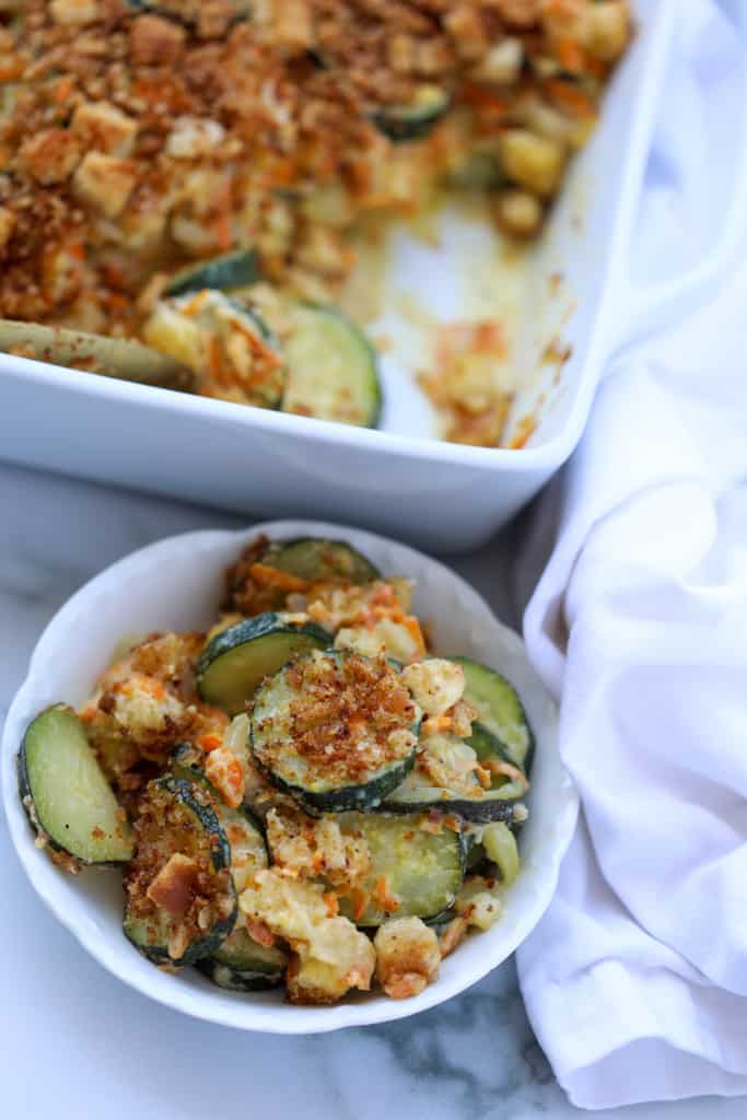 zucchini casserole with stuffing mix in a small bowl with fork