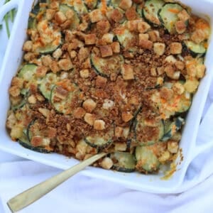 zucchini stuffing casserole in a white square pan