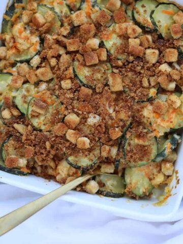 zucchini stuffing casserole in a white square pan