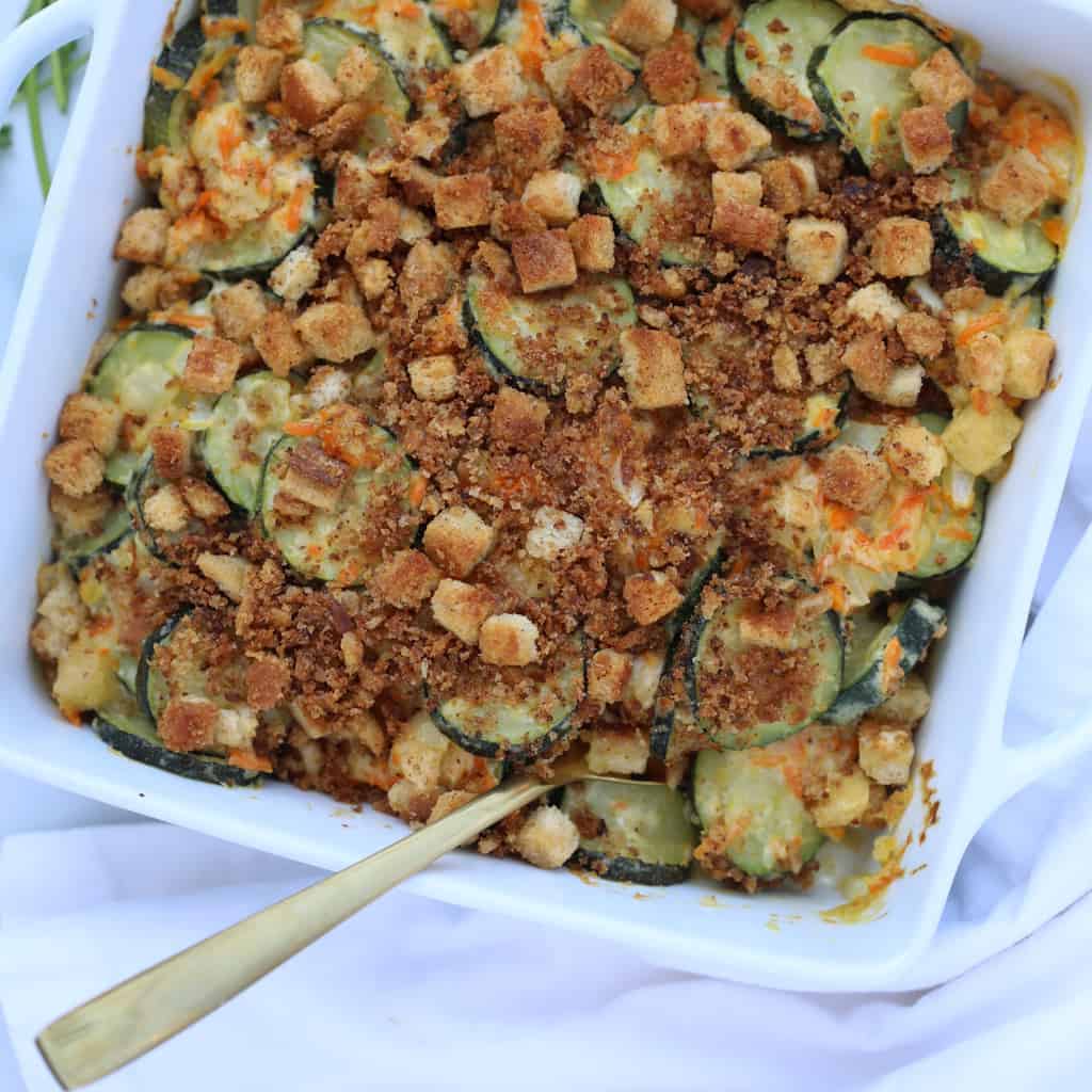 zucchini stuffing casserole in a white square pan