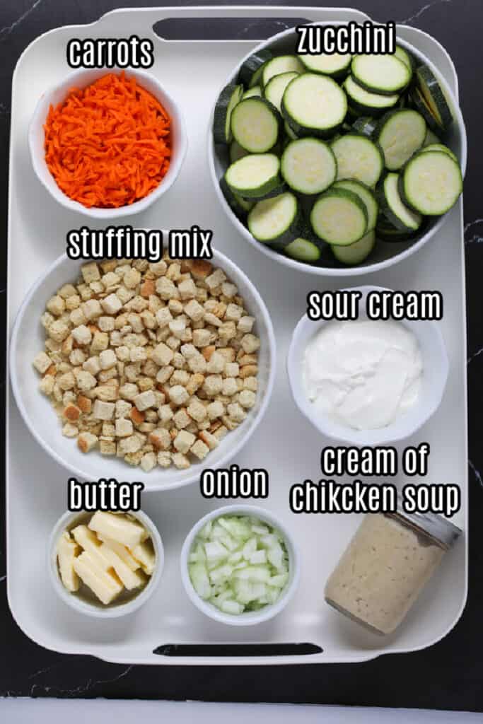 zucchini with stuffing casserole ingredients on a white tray