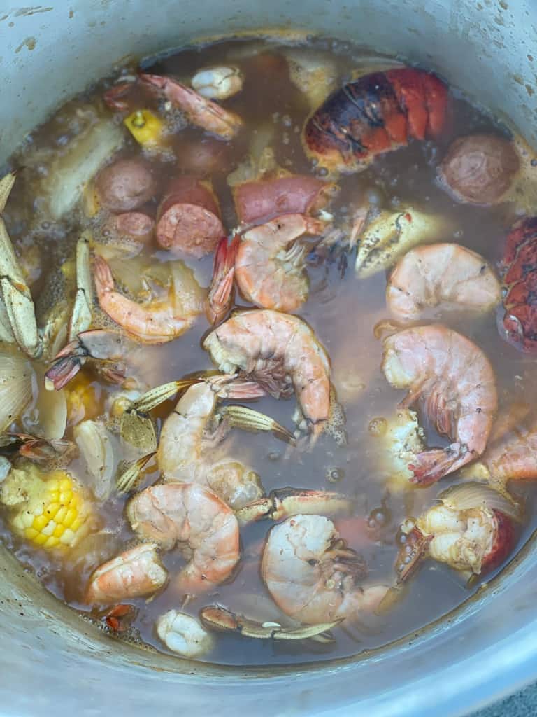 add the shrimp and sausage to the pot