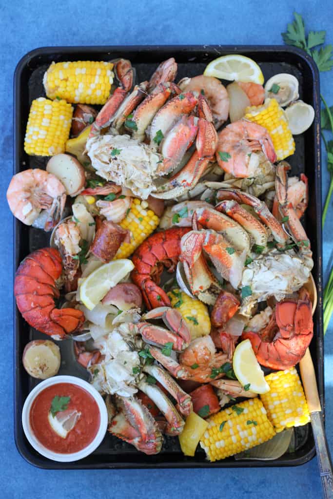 seafood boil spread on a baking sheet