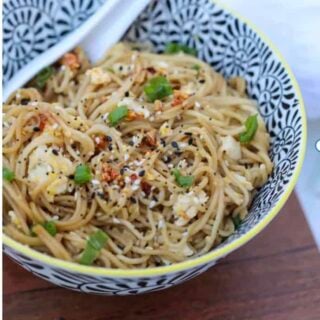 TikTok ramen recipe in a bowl with a spoon ready to eat