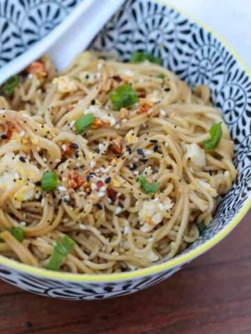 TikTok ramen recipe in a bowl with a spoon ready to eat