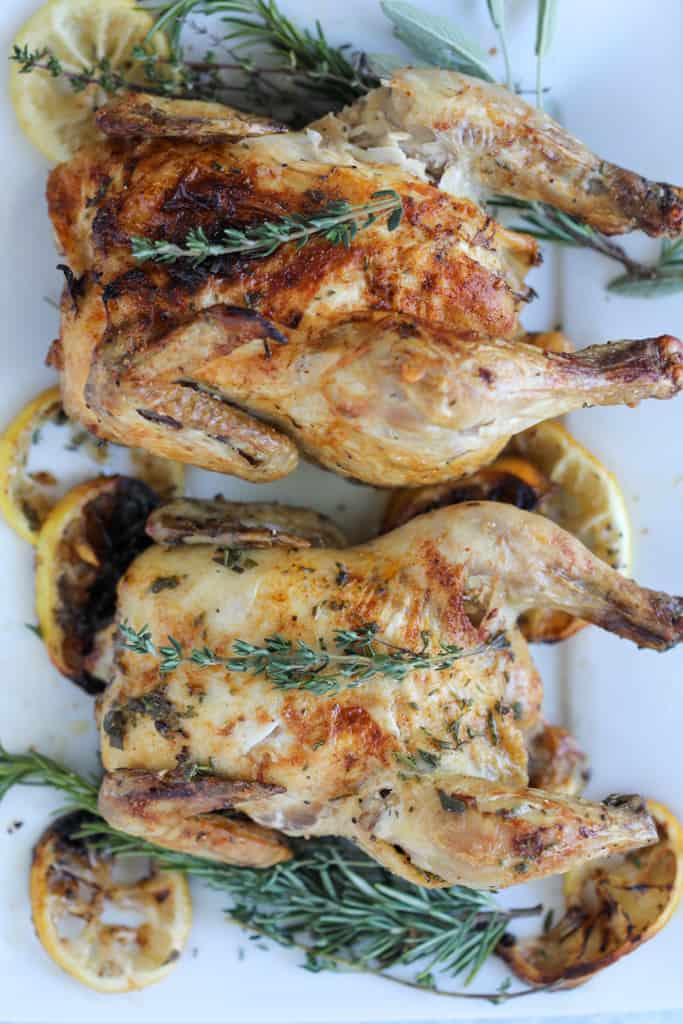 air fryer cornish hens on a white platter