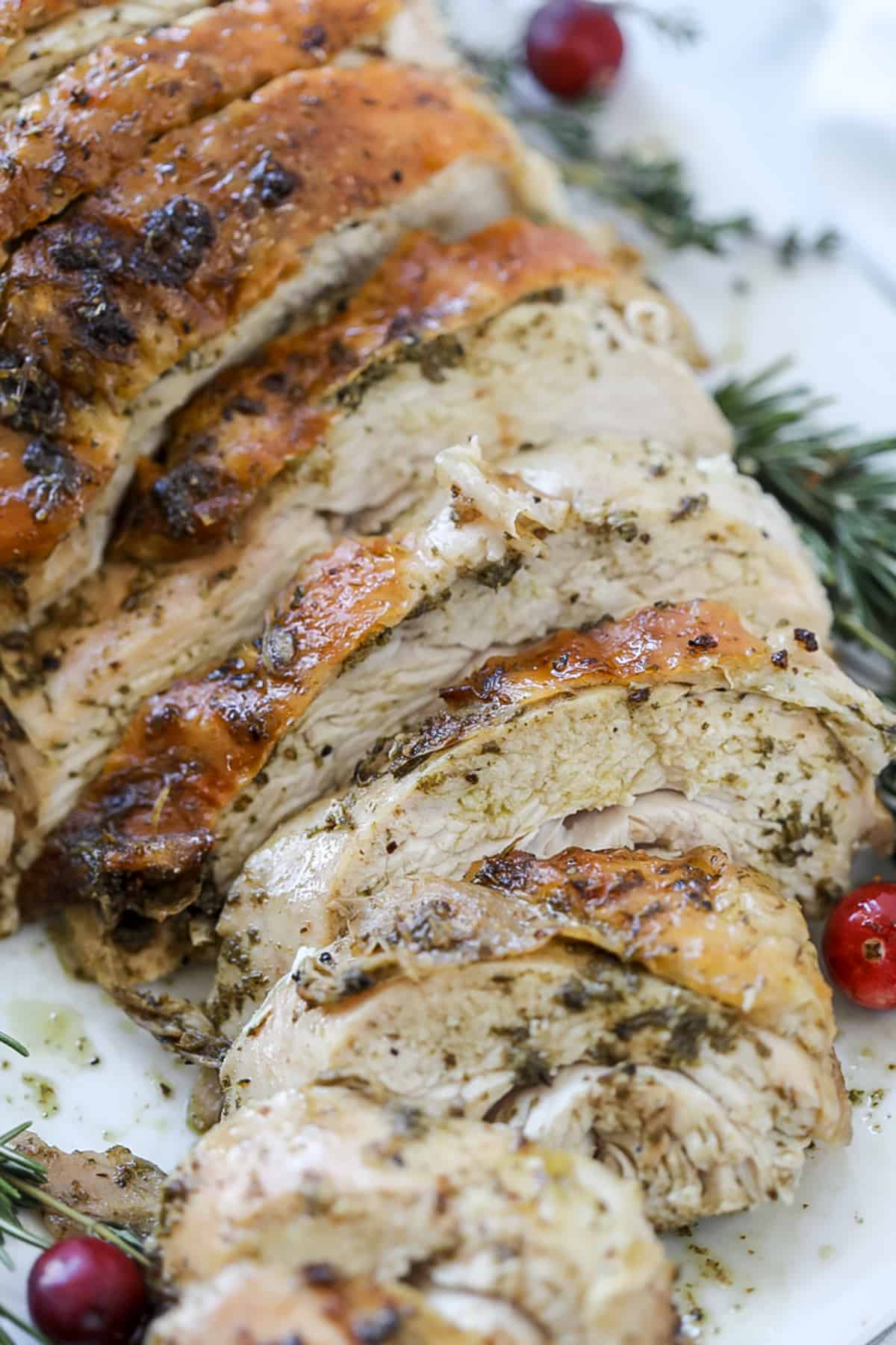roasted half turkey breast recipe sliced on a platter after baking in the oven