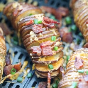 accordion hasselback potatoes in air fryer after cooking in an air fryer basket