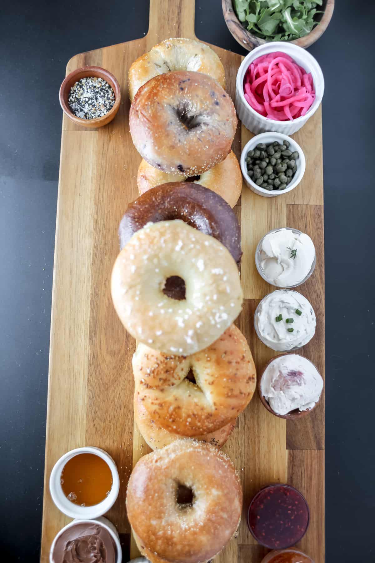add the little bowls and sauces to the board