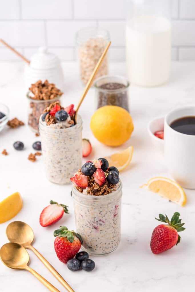 many oatmeal chia seed puddings on a white background with various toppings like peanut butter banana blueberry and apple cinnamon